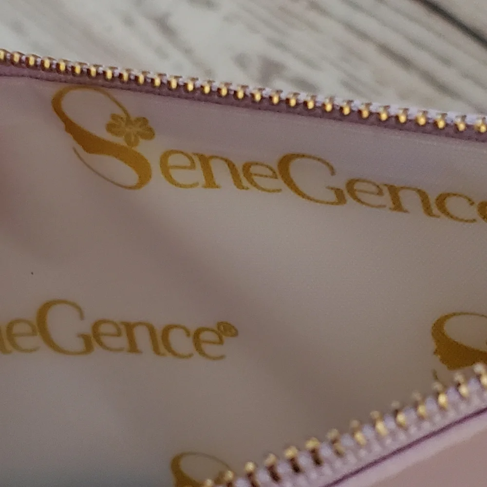 SeneGence pearlized pink vinyl makeup bag with skin care samples